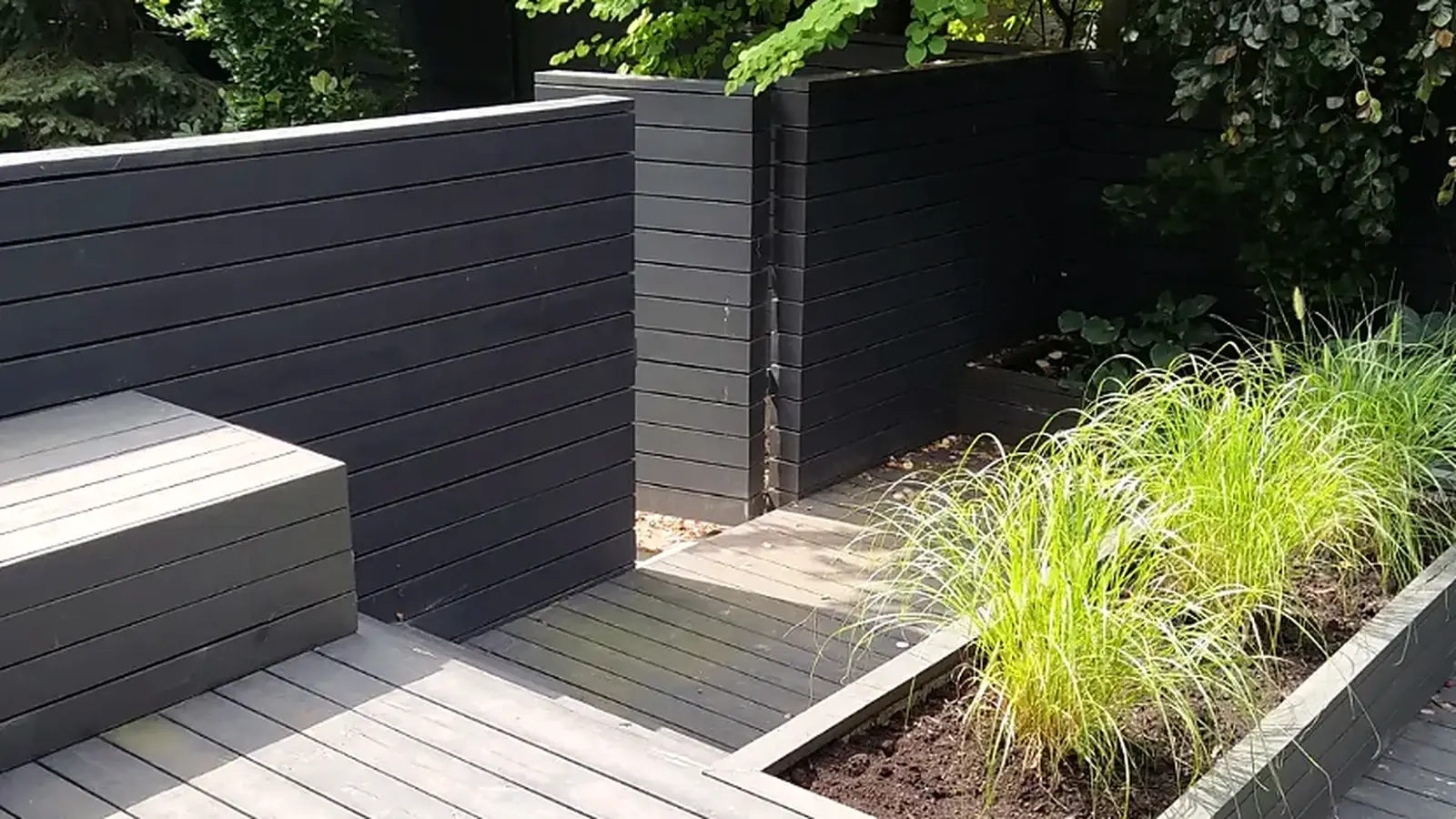 Real finished dark-stained deck and built-in outdoor planters